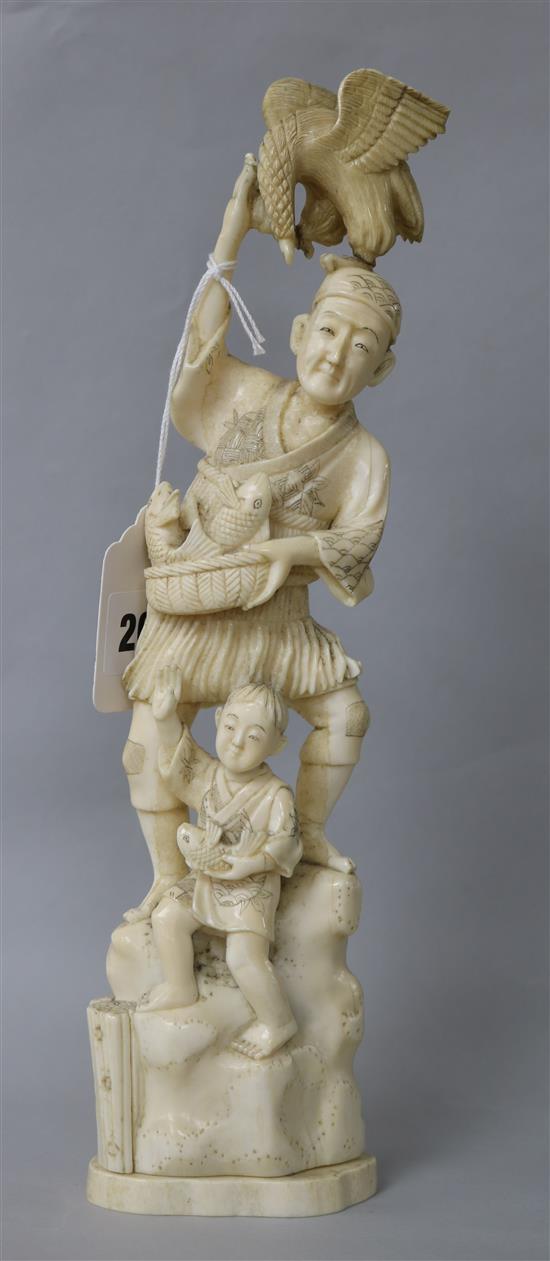 A Japanese walrus ivory okimono of a fisherman, early 20th century 29cm